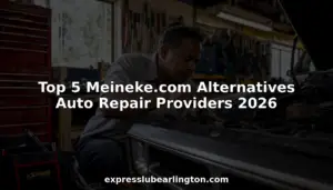 Mechanic inspecting car engine in auto repair shop