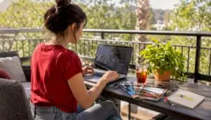 Woman searching mechanic alternatives on laptop