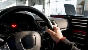 Car dashboard with red low oil pressure warning light