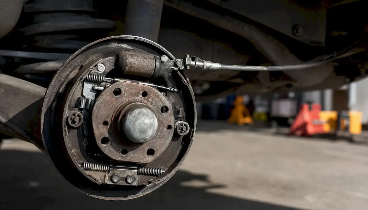 Rear brake assembly with parking brake cable detail