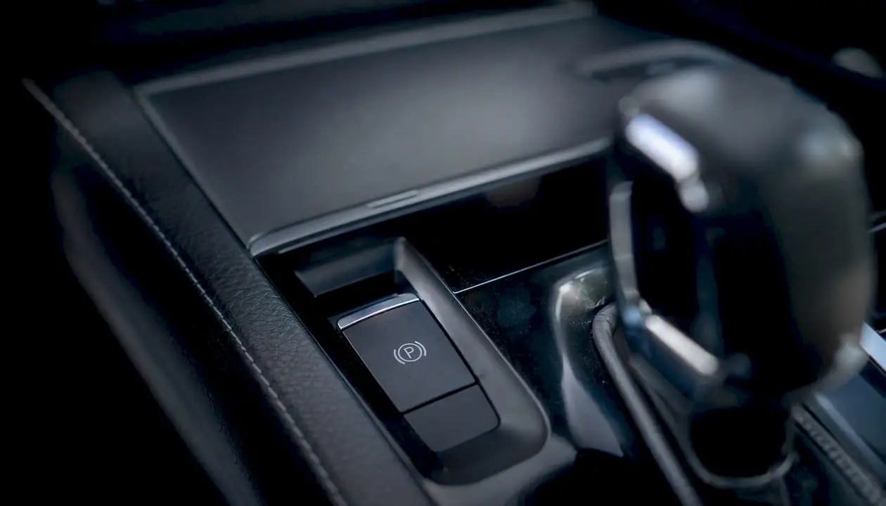 Electronic parking brake button near gear shifter