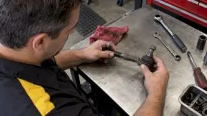 Mechanic checking an outer tie rod end